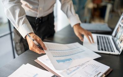 Businessman With Spreadsheets