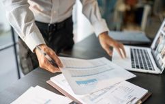 Businessman With Spreadsheets
