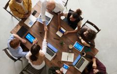 People Around A Table At A Business Meeting